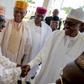 President Muhammadu Buhari shakes hands with Senator Ahmed Makarfi of the PDP during a political meeting