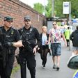 Armed police officers stand guard in Manchester, northwest England, on May 27, 2017