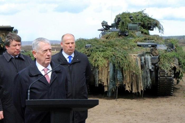 US Defense Secretary James Mattis flanked by his Lithuanian and Latvian counterparts after meeting troops in Lithuania