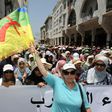 A protester waves a flag of the Amazigh, Morocco's Berber community, during a demonstration in downtown Rabat on June 11, 2017