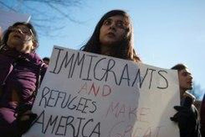 People protest outside the White House on February 4, 2017