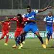 Aliassou Sanou of Rivers United challenges Chisom Egbuchulam of Rangers