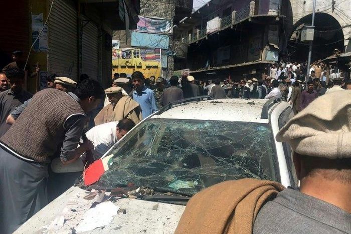 Pakistanis gather at the site of a bomb blast at a market in Parachinar, capital of the Kurram tribal district, on March 31, 2017