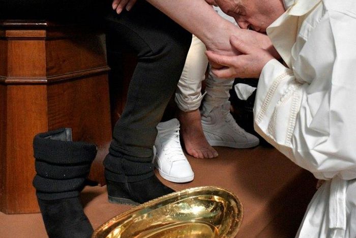 This handout picture released by the Vatican press office shows Pope Francis washing the feet of inmates at the Paliano prison outside Rome on April 13, 2017 during the Holy Thursday celebrations