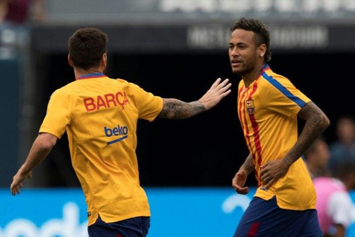 Neymar (R) and Lionel Messi of FC Barcelona talk before a match between Juventus FC and FC Barcelona at the Met Life Stadium in East Rutherford, New Jersey