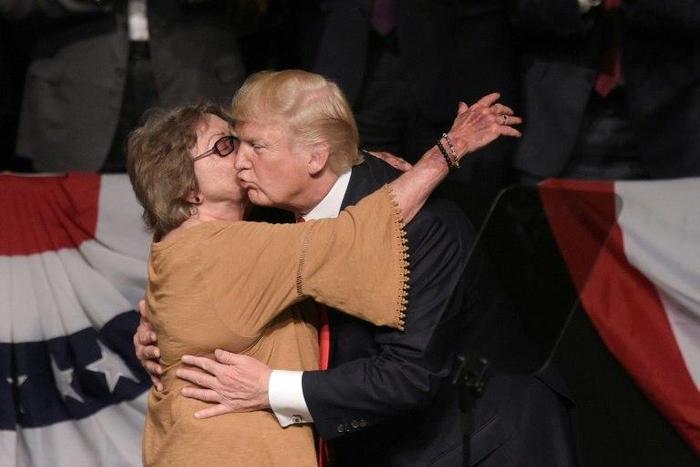US President Donald Trump hugs Cuban dissident Cary Roque as he tightens restrictions on trade and travel to the island