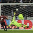 Lille's Yassine Benzia (L) kicks scores a penalty despite Lyon's Anthony Lopes (C) dive during their Ligue 1 match on January 28, 2017