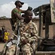 Nigerian soldiers on patrol in Banki, Borno State, to guard against infiltration or attack by Boko Haram insurgents