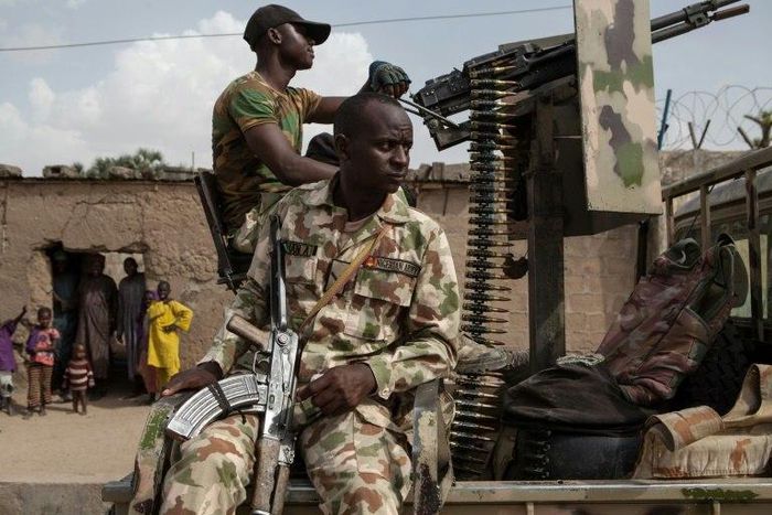 Nigerian soldiers on patrol in Banki, Borno State, to guard against infiltration or attack by Boko Haram insurgents