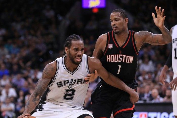 Kawhi Leonard of the San Antonio Spurs drives against Trevor Ariza of the Houston Rockets in Game Two of the NBA Western Conference semi-finals, at AT&T Center in San Antonio, Texas, on May 3, 2017