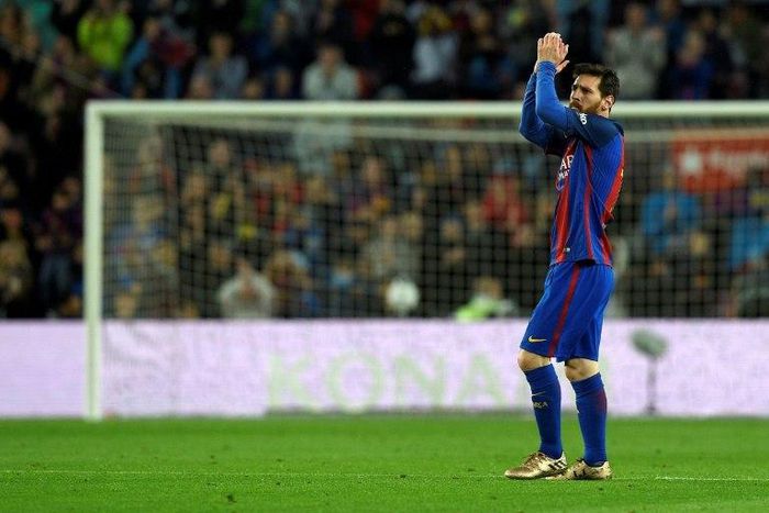 Barcelona's forward Lionel Messi celebrates after scoring a goal during the Spanish league football match against Osasuna April 26, 2017