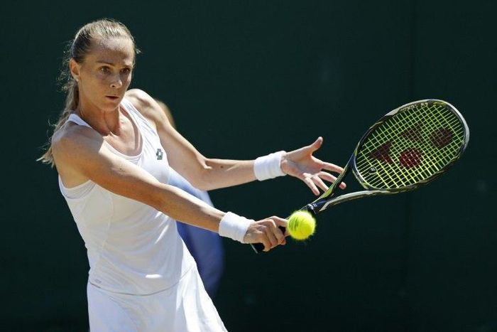 Slovakia's Magdalena Rybarikova returns against Croatia's Petra Martic at Wimbledon on July 10, 2017