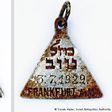 Tracing charm from Nazi camp to a young victim