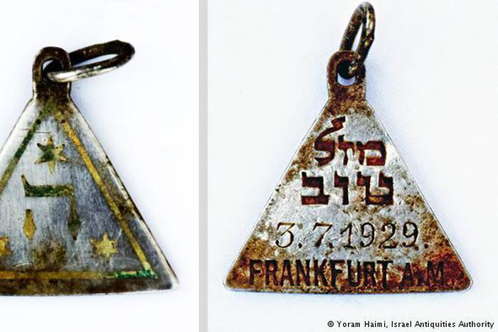 Tracing charm from Nazi camp to a young victim