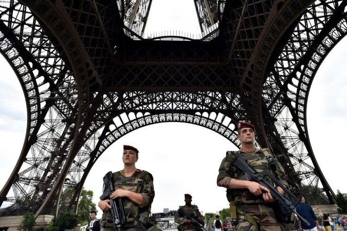 Armed French troops patrol at the Eiffel Tower in Paris