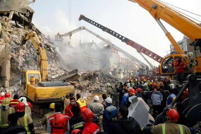 Emergency personnel search on January 20, 2017 for victims in the wreckage of the 15-storey Plasco building in the capital Tehran, which collapsed the previous day