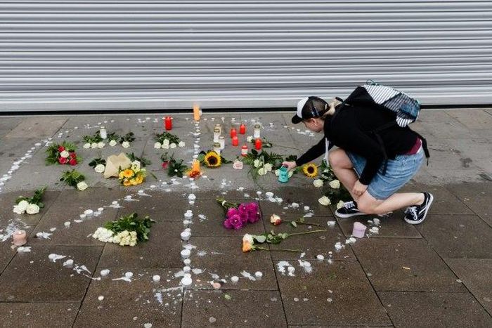 Hamburg residents have laid flowers outside the supermarket where the attack took place