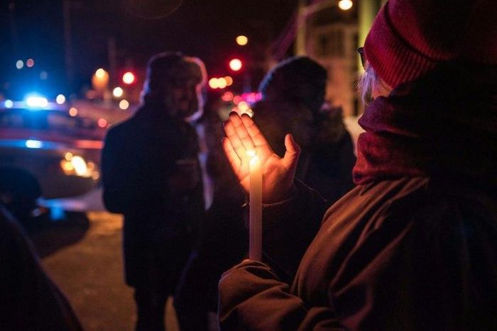 People come to show their support for the victims after an attack at a mosque in the Québec City Islamic cultural center on January 29, 2017