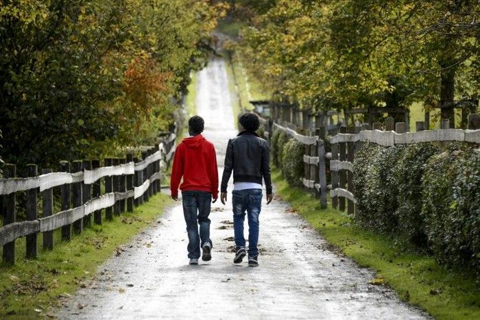 Eritrean asylum seekers walk in the canton of Schwyz in 2014