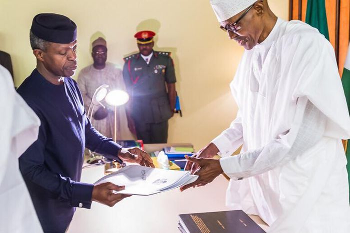 President Muhammadu Buhari receives Presidential Investigation Panel Report from Vice President Yemi Osinbajo in Abuja