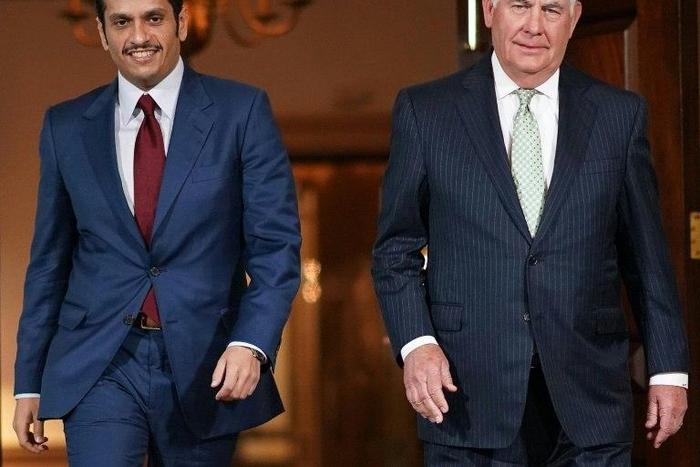 Qatari Foreign Minister Sheikh Mohammed bin Abdulrahman Al-Thani(L) heads into talks with US Secretary of State Rex Tillerson in Washington on June 27, 2017
