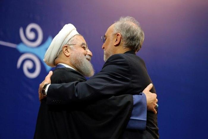 Iranian President Hassan Rouhani (L) made a 2015 nuclear deal with world powers the centrepiece of his first term. Here he awards atomic energy chief Ali Akbar Salehi the medal of honour on February 8, 2016
