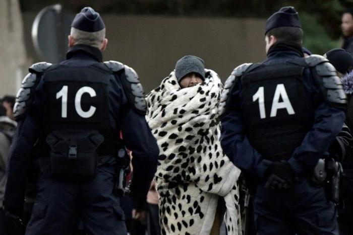 Police moved in at dawn to clear the migrants