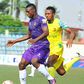 Stephen Odey, the league's highest goal scorer shielding the ball from a Plateau United player