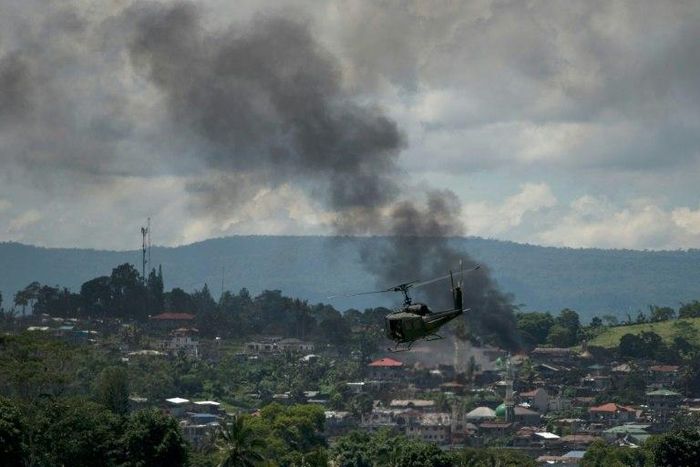 The Philippine military is using air strikes against snipers hidden in high rise buildings in the southern city of Marawi