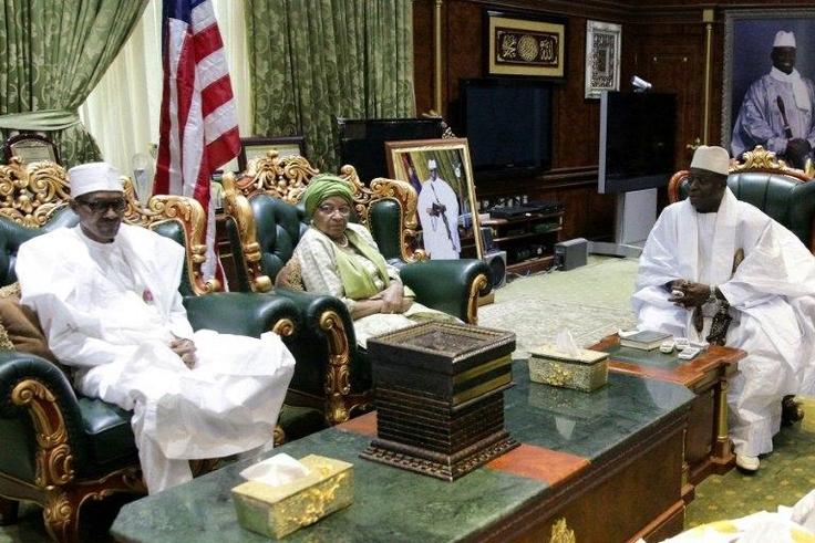 Nigerian President Muhammadu Buhari (L) and Liberian President Ellen Johnson Sirleaf meeting Gambian President Yahya Jammeh (R) in Banjul on January 13, 2017
