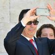 US Secretary of Treasury Steven Mnuchin snaps a picture with his smartphone at the end of a G7 summit of finance ministers where they pledged to combat cyber crime