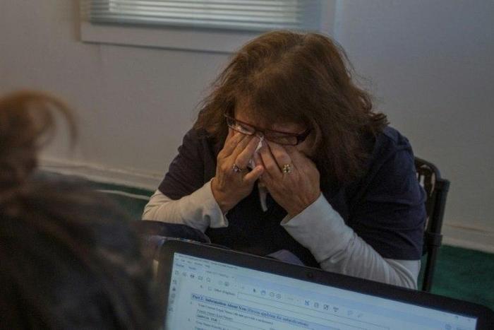 Gloria Eliza cries while applying for citizenship at the TODEC (Training Occupational Development Educating Communities) office on February 24, 2017 in Coachella, California