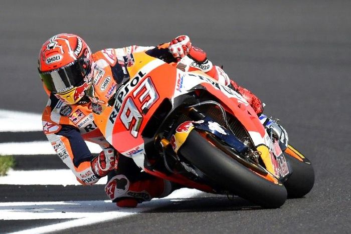 Rider Marc Marquez exits Luffield Corner during the fourth free practice session of the British Grand Prix weekend in Northamptonshire, southern England, on August 26
