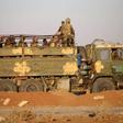 Syrian government soldiers ride in a truck near a border crossing with Jordan on July 6, 2018, after they reseized it from rebel forces