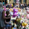 People gather in St Ann's Square in Manchester, northwest England