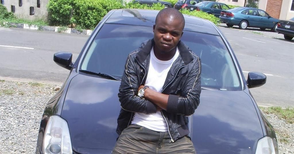 Dagrin sitting on his Nissam Maxima