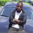 Dagrin sitting on his Nissam Maxima