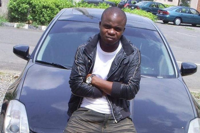 Dagrin sitting on his Nissam Maxima