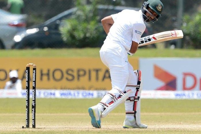 Bangladesh batsman Mahmudullah Riyad looks back at his shattered wicket after his dismissal by Sri Lankan bowler Lahiru Kumara during the first Test against Sri Lanka in Galle on March 9, 2017