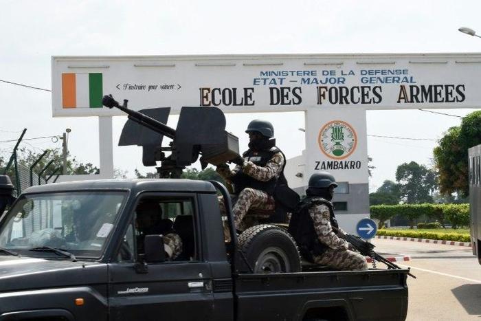Ivory Coast's main port of Abidjan, one of Africa's biggest, was shut down when angry security forces began firing into the air amid protests by mutinous troops