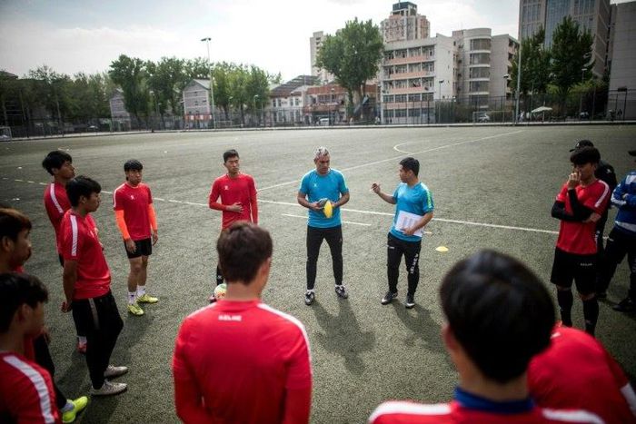 Beijing Institute of Technology's Spanish head coach Roberto Ahufinger del Pino instructs players during a training session in the Chinese capital