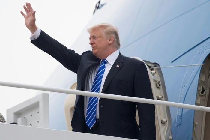 US President Donald Trump boards Air Force One prior to departure from Andrews Air Force Base in Maryland, July 5, 2017, as he travels on a 4-day trip to Poland and Germany