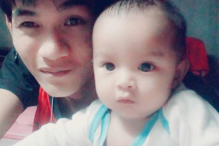 Wuttisan Wongtalay and the infant.