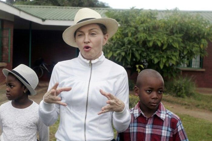 US pop superstar Madonna adopted Malawian children David Banda (R) in 2006 and Mercy James in 2009