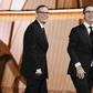 Writer/producer Tim Carvell (L) and TV personality John Oliver accept Outstanding Variety Talk Series for 'Last Week Tonight with John Oliver' at the 2016 Emmy Awards
