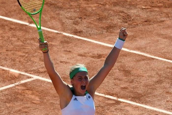 Latvia's Jelena Ostapenko celebrates after beating Switzerland's Timea Bacsinszky during the French Open on June 8, 2017