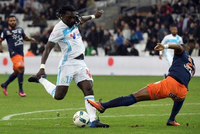 Olympique de Marseille striker Bafetimbi Gomis (L) scores a goal during the French football match against Montpellier at the Velodrome Stadium in Marseille on January 27, 2017