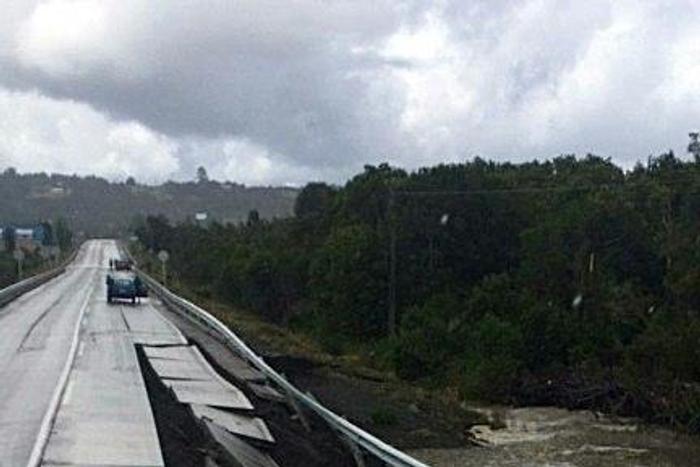 View of a bridge damaged by a 7.7-magnitude earthquake in Castro on Chiloe Island, southern Chile, on December 25, 2016
