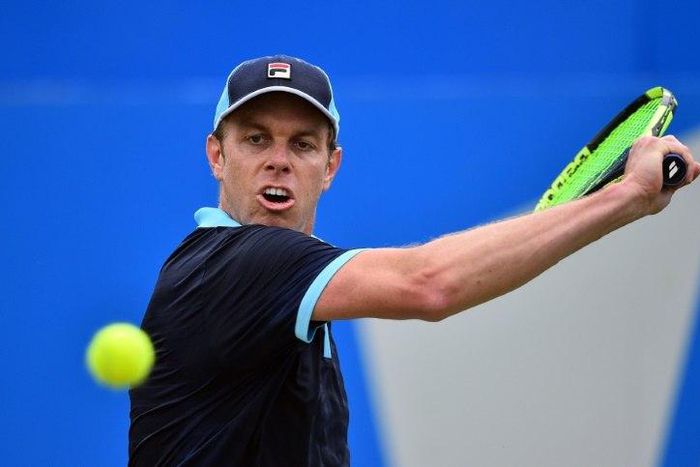 Sam Querrey of the US returns during his men's singles second round match against Australia's Jordan Thompson at the ATP Aegon Championships tennis tournament at the Queen's Club in west London on June 22, 2017