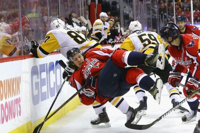 Sidney Crosby (No. 87) of the Pittsburgh Penguins checks T.J. Oshie of the Washington Capitals in Game Five of the NHL Eastern Conference 2nd round, at the Verizon Center in Washington, DC, on May 6, 2017